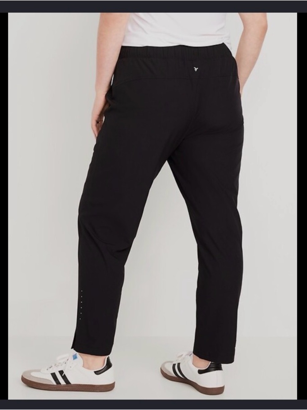 Large Old Navy Mid-Rise StretchTech Tapered Run Pants in black.